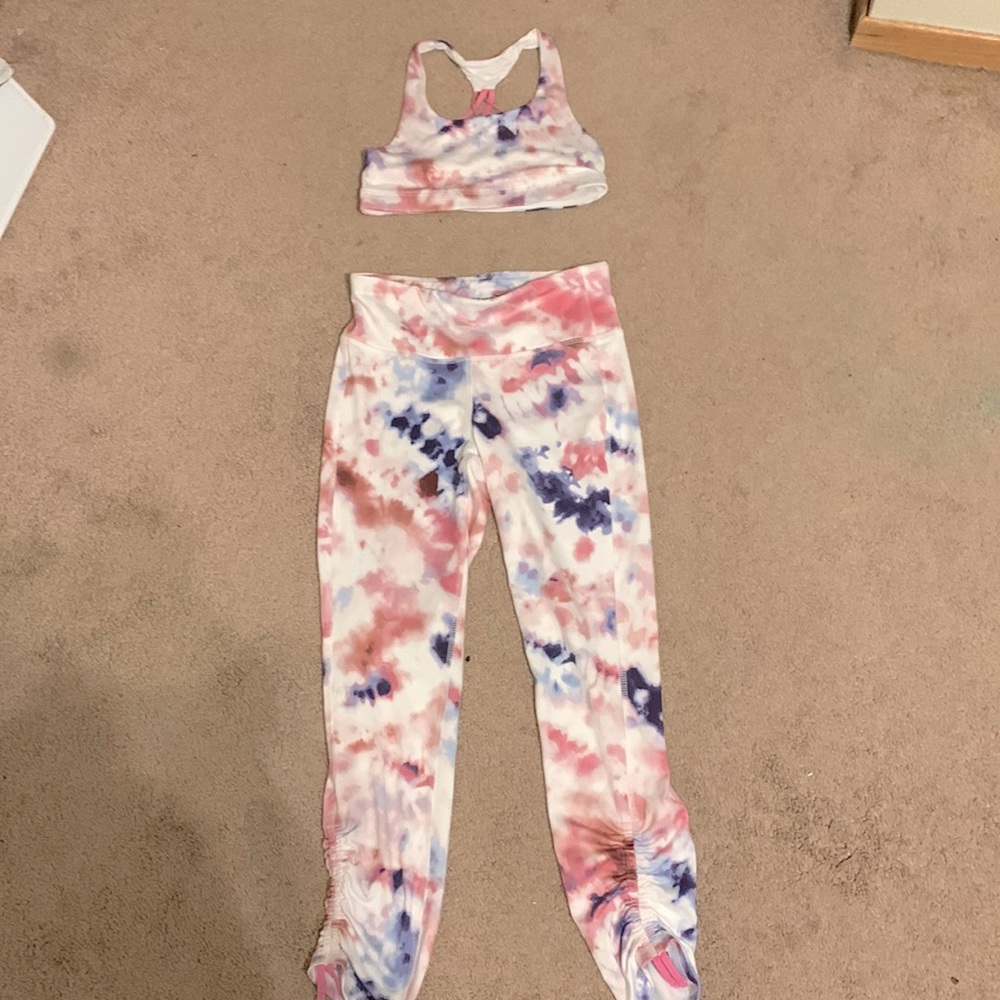 Workout pink and purple set with a sports bra with the same color as the bottom.